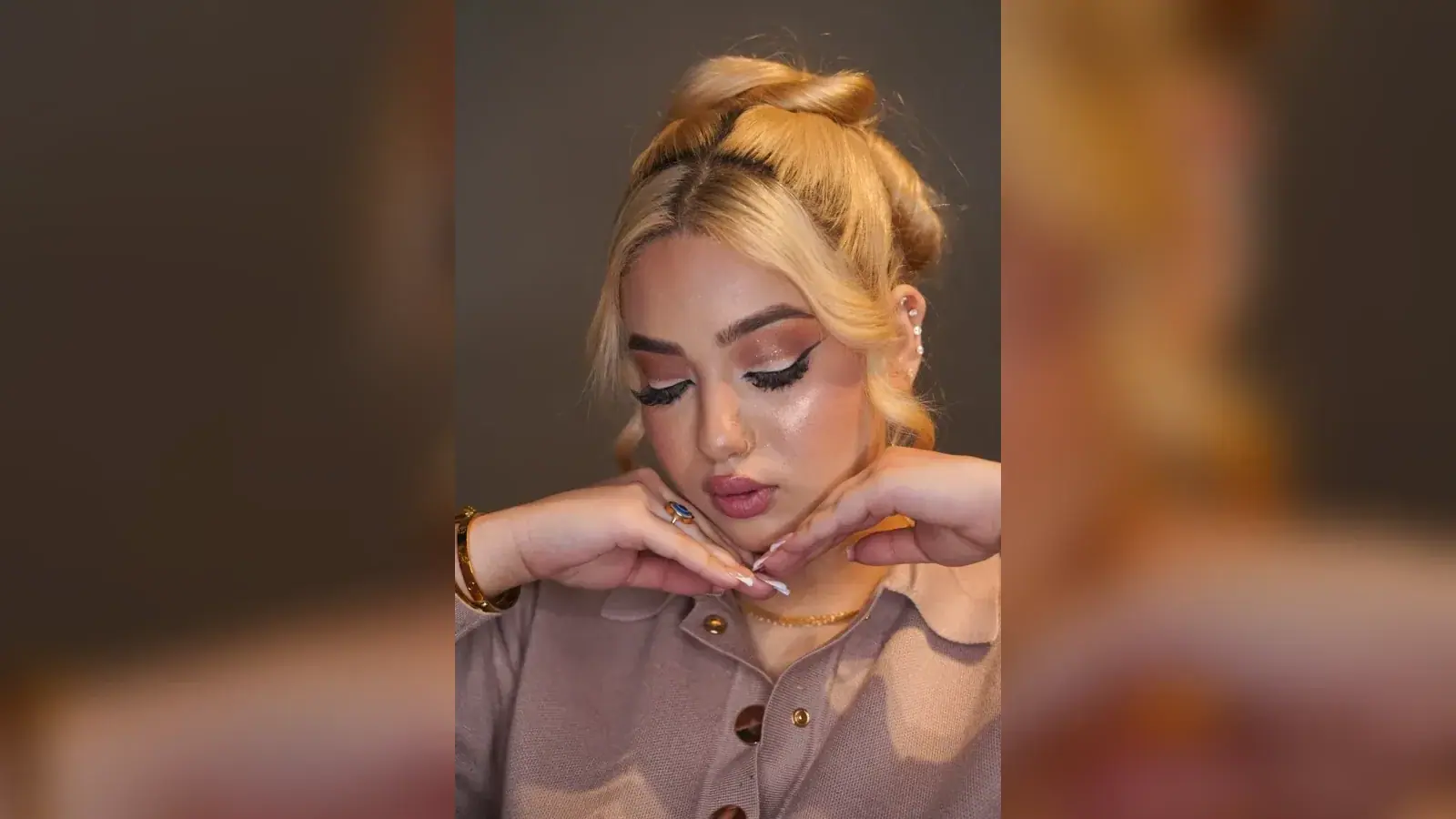 Party makeup with a winged liner and styled blonde hair at House of Salons F-10 Markaz, Islamabad