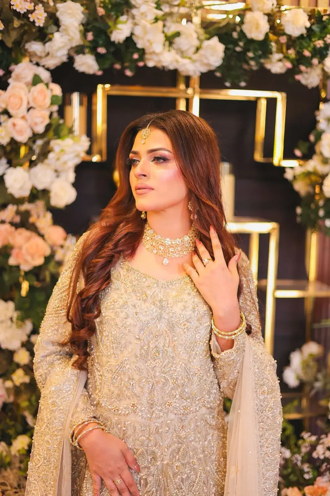 Bridal makeup with glossy red-brown waves at House of Salons F-10 (Unisex), F-10 Markaz, Islamabad