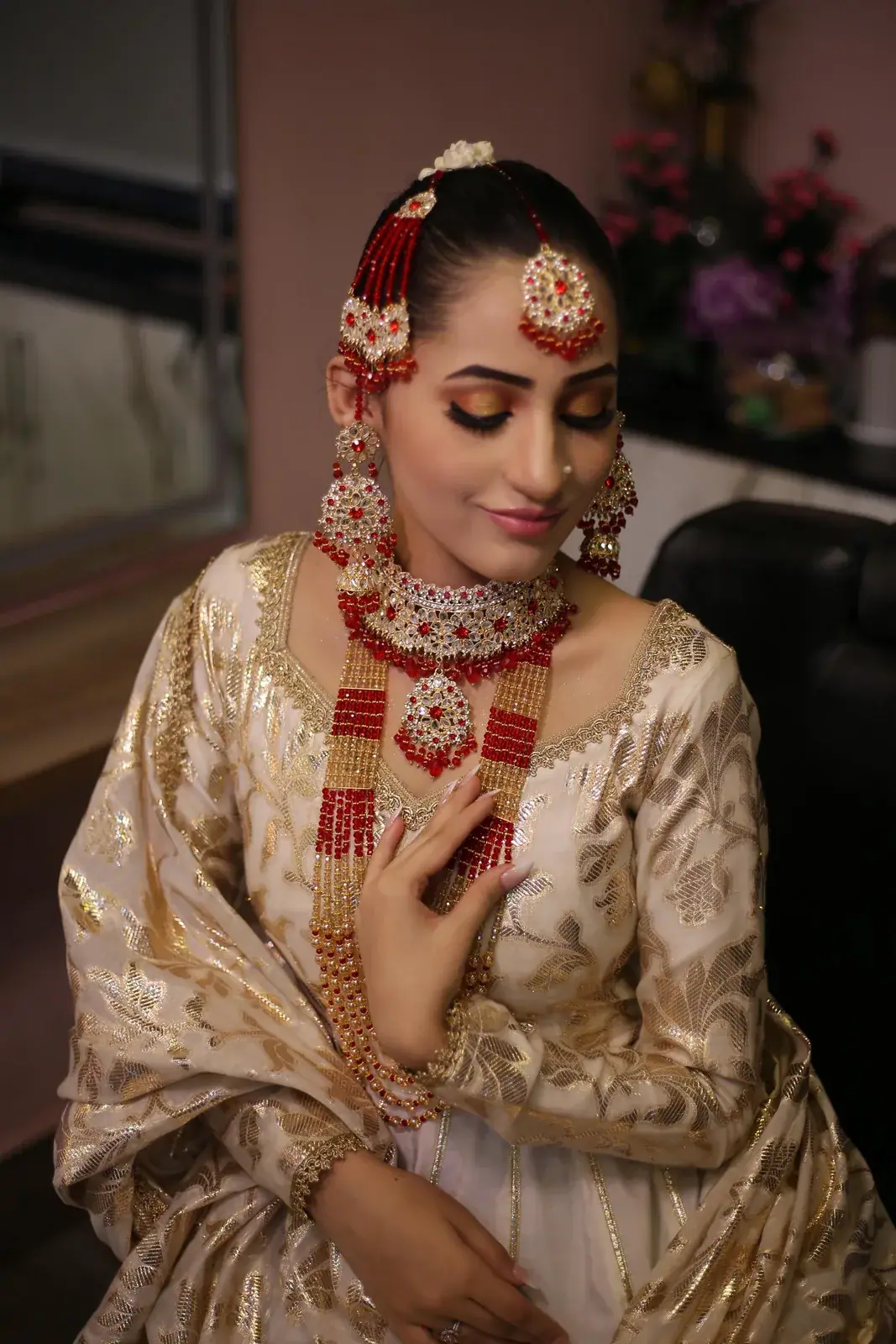 Bridal makeup with red and gold jewellery at House of Salons F-7 (Ladies), F-7 Markaz, Islamabad