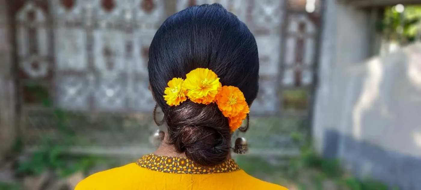 Detailed view of an intricate bridal updo adorned with delicate wedding pins