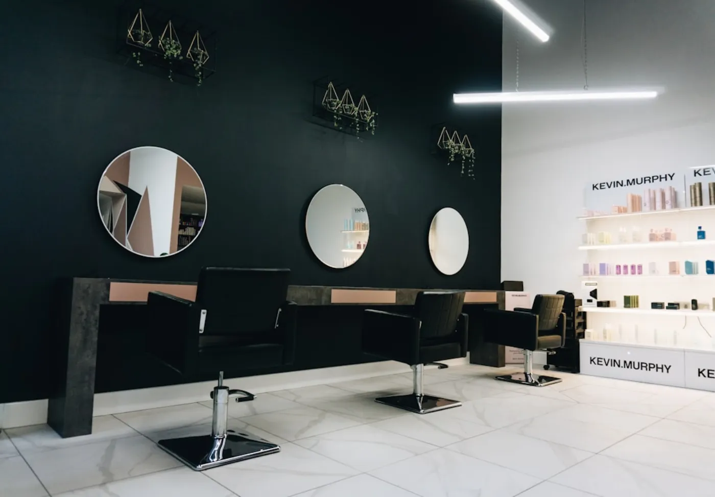 Client receiving a professional hair treatment in a salon chair