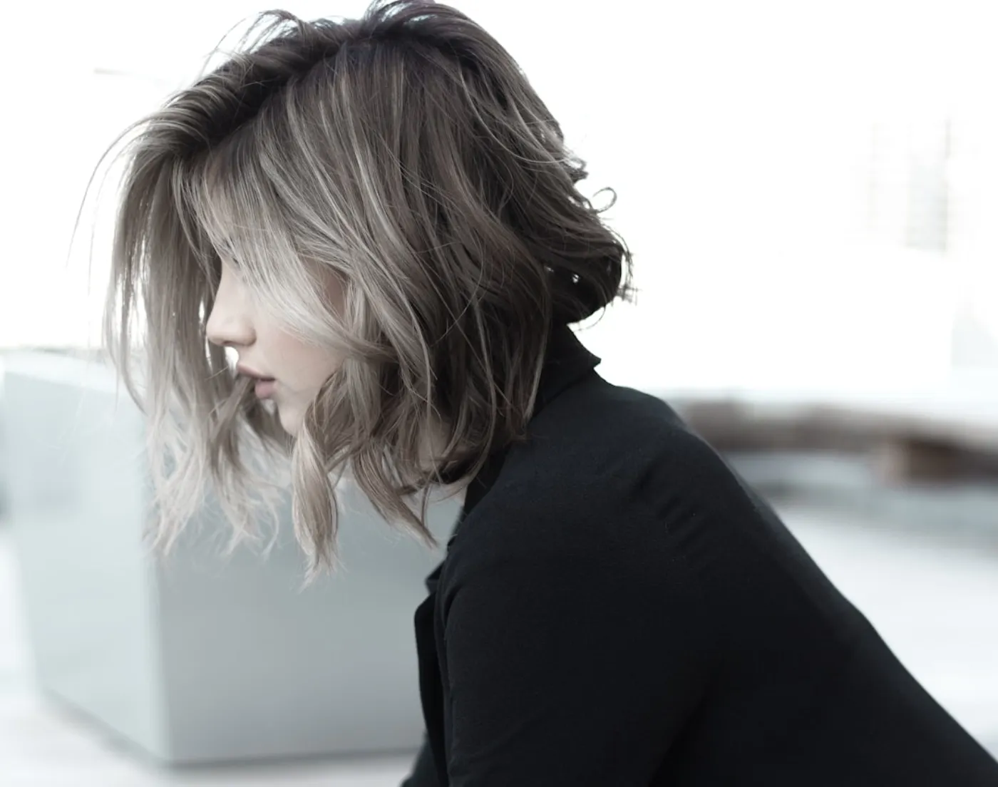 Modern layered haircut styling in salon