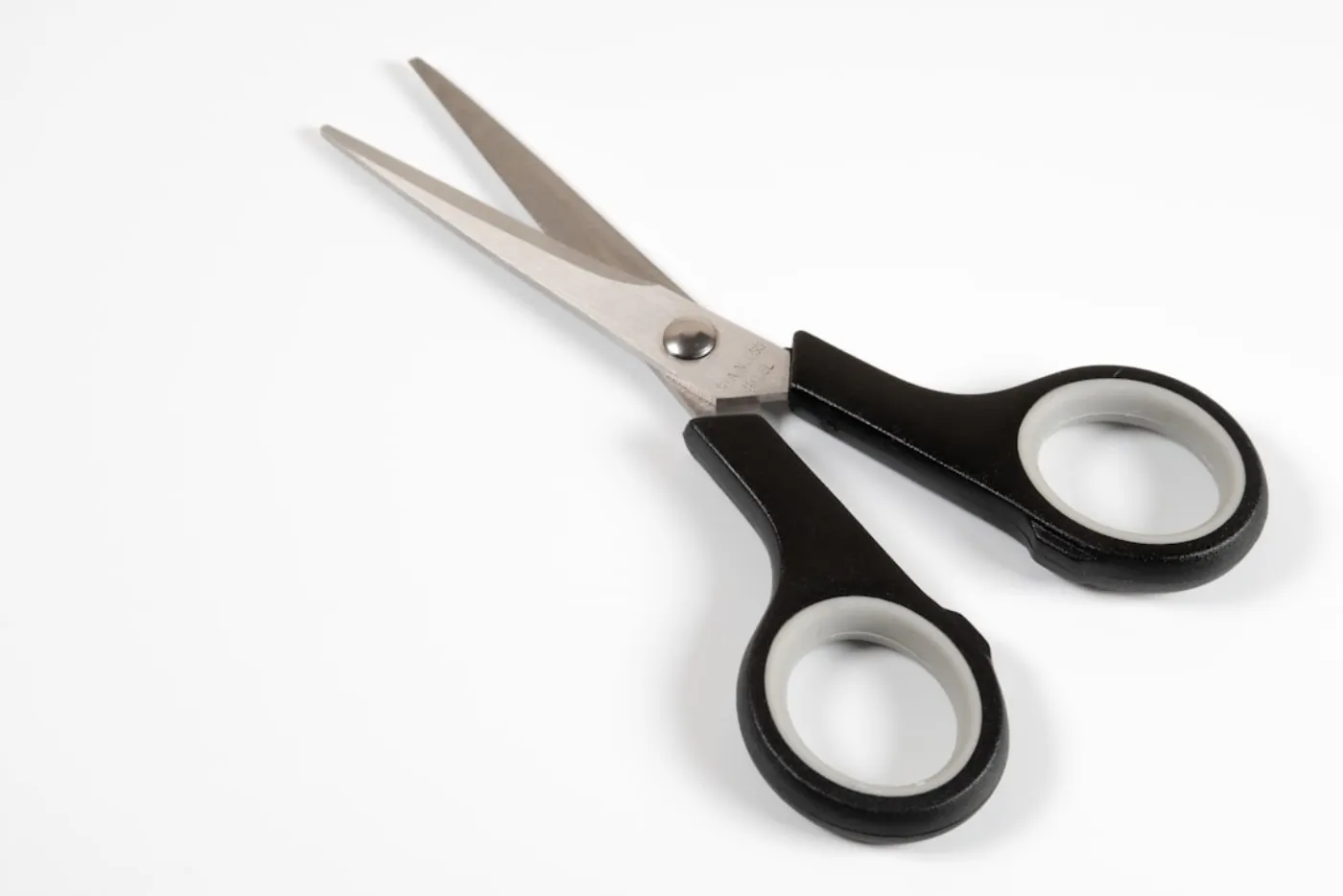 Gentleman receiving precision scissor haircut