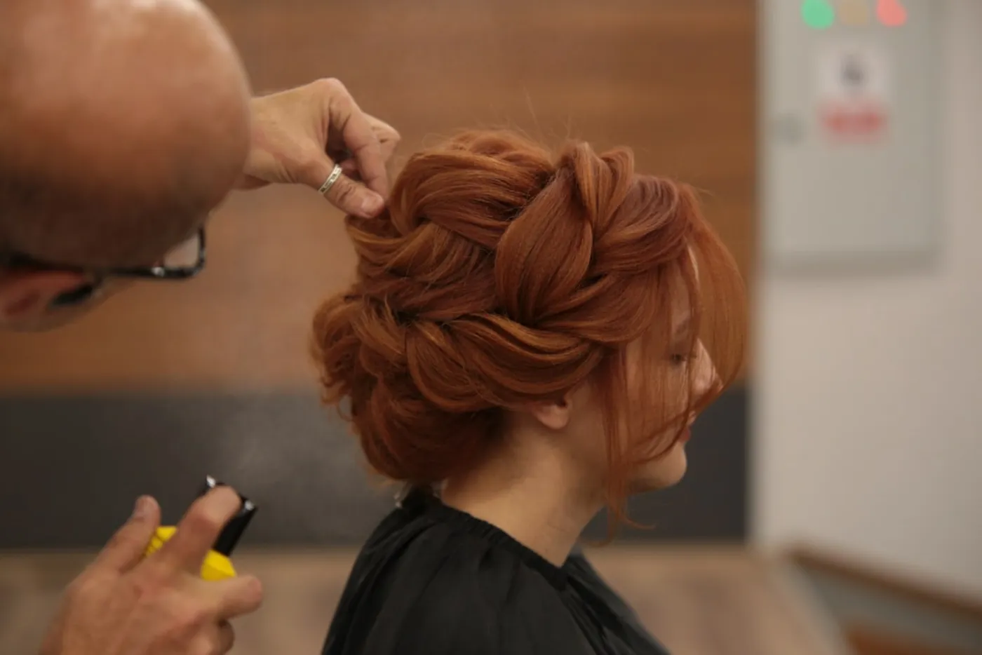 Stylist applying hair gloss at House of Salons in Islamabad