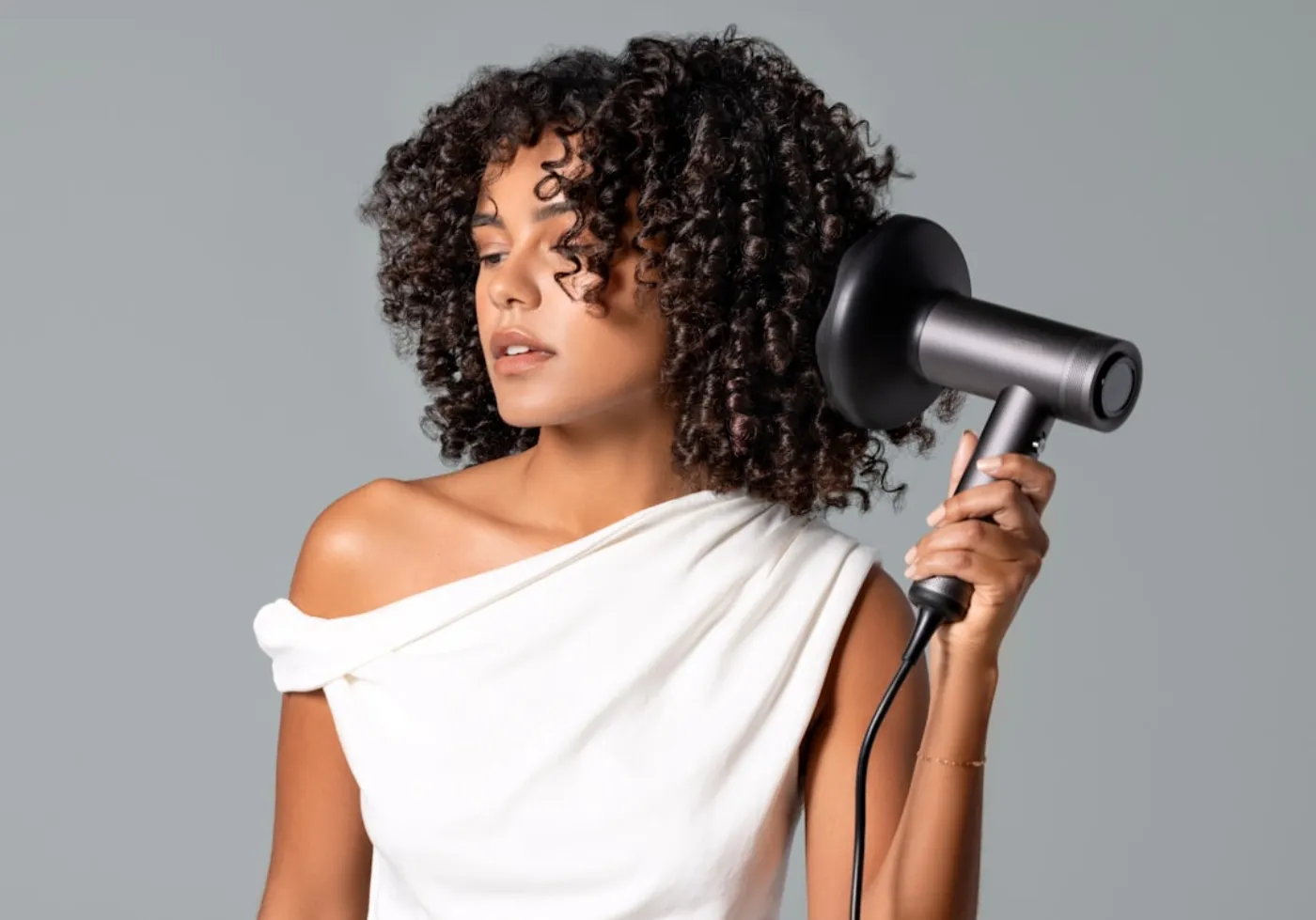 A sleek blowdry finish highlighting natural hair movement