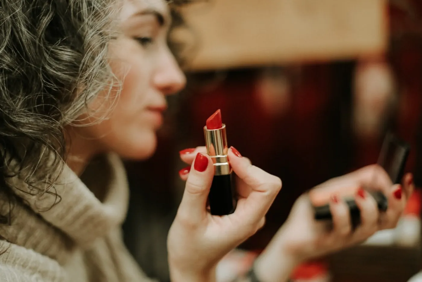 Perfectly applied bold red lipstick on a woman's lips