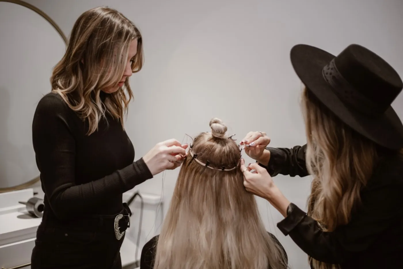 Stylist assessing client hair and scalp health