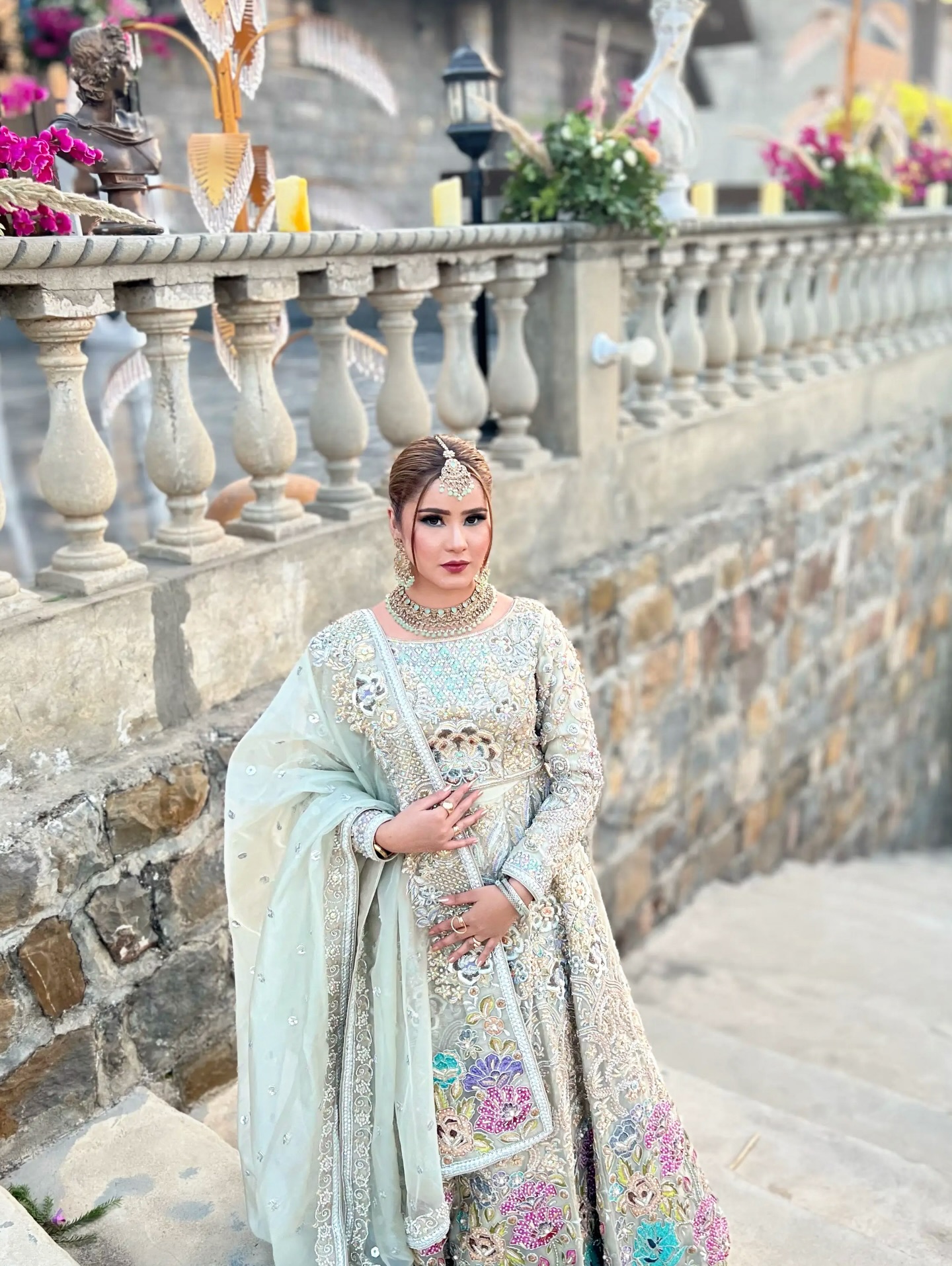 Bridal hair and makeup portrait on a stone balcony by House of Salons