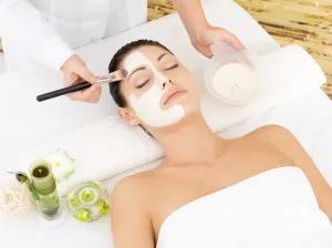 young-woman--salon-with-cosmetic-mask-face-high-angle-photo.