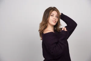 young-beautiful-woman-warm-knitted-sweater-standing-posing