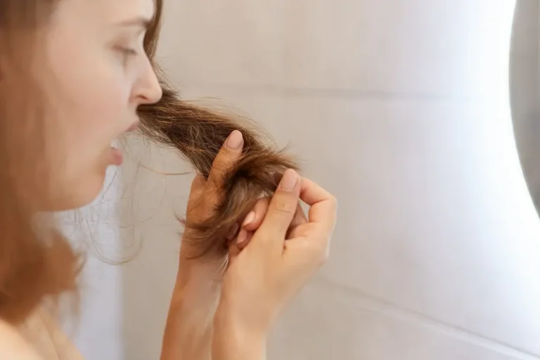 closeup-profile-portrait-upset-astonished-woman-looking-her-dry-hair-having-problems-needs-change-shampoo-special-treatment-trichological-clinic