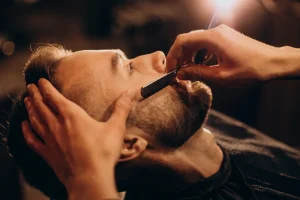 handsome-man-shaving-beard-barbershop-1