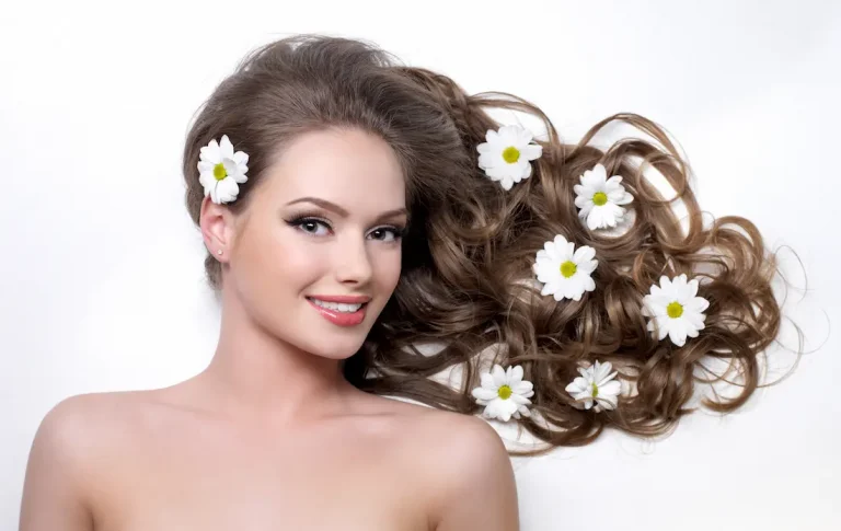 smiling-woman-with-beautiful-long-hair-wna-flowers-it-white